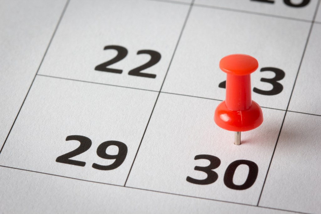 gettyimages-510240901 Concept image of a calendar with red push pins. Available in high resolution